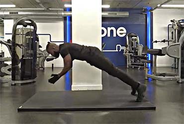 Personal Trainer Demonstrating How To Perform Clapping Push Ups